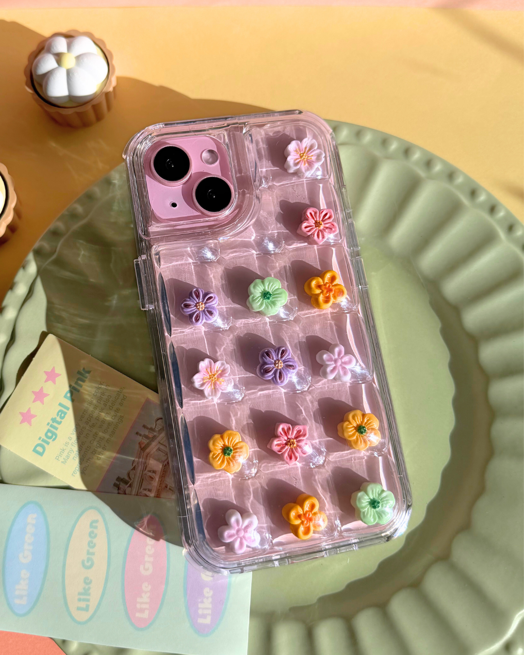 a clear bubble phone case decorated with cute flower charms