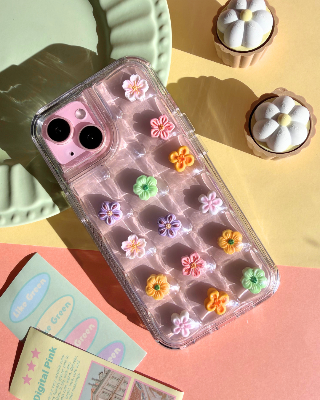a clear bubble phone case decorated with cute flower charms